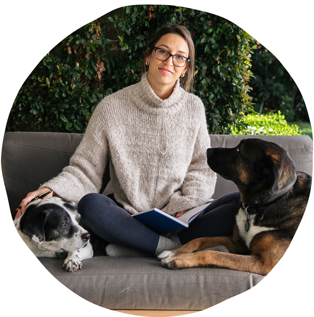 a photo of the CEO and Co-Founder, Terri, with her two dogs.