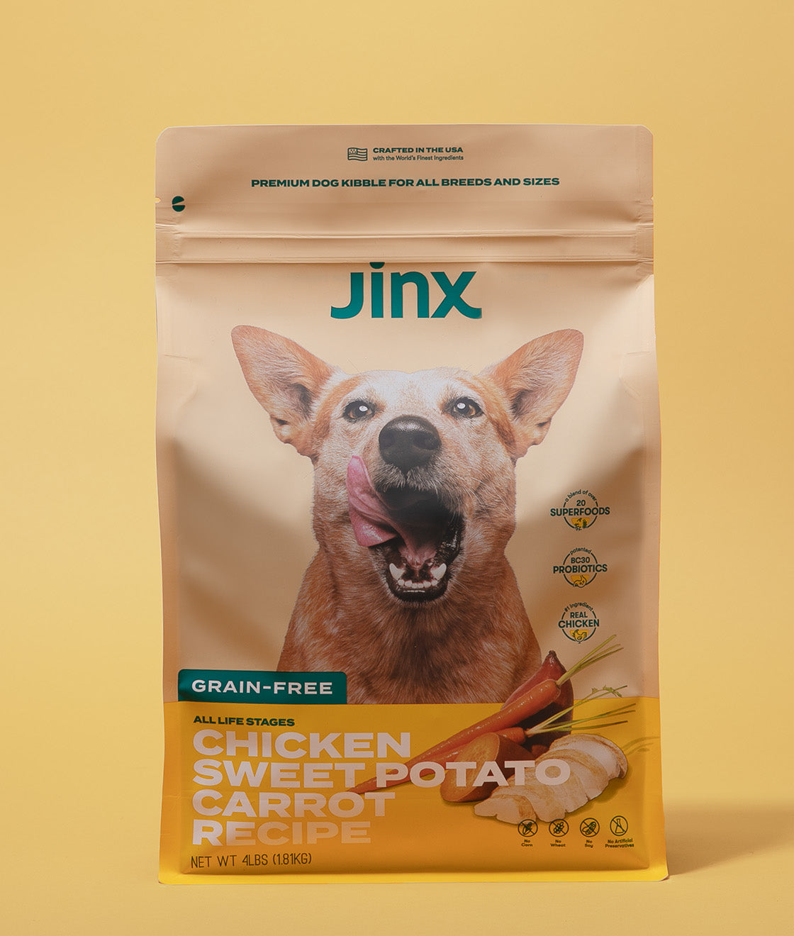 Grain-free chicken essentials Jinx bundle including chicken, sweet potato & carrot Jinx dog kibble product packaging on a yellow background.