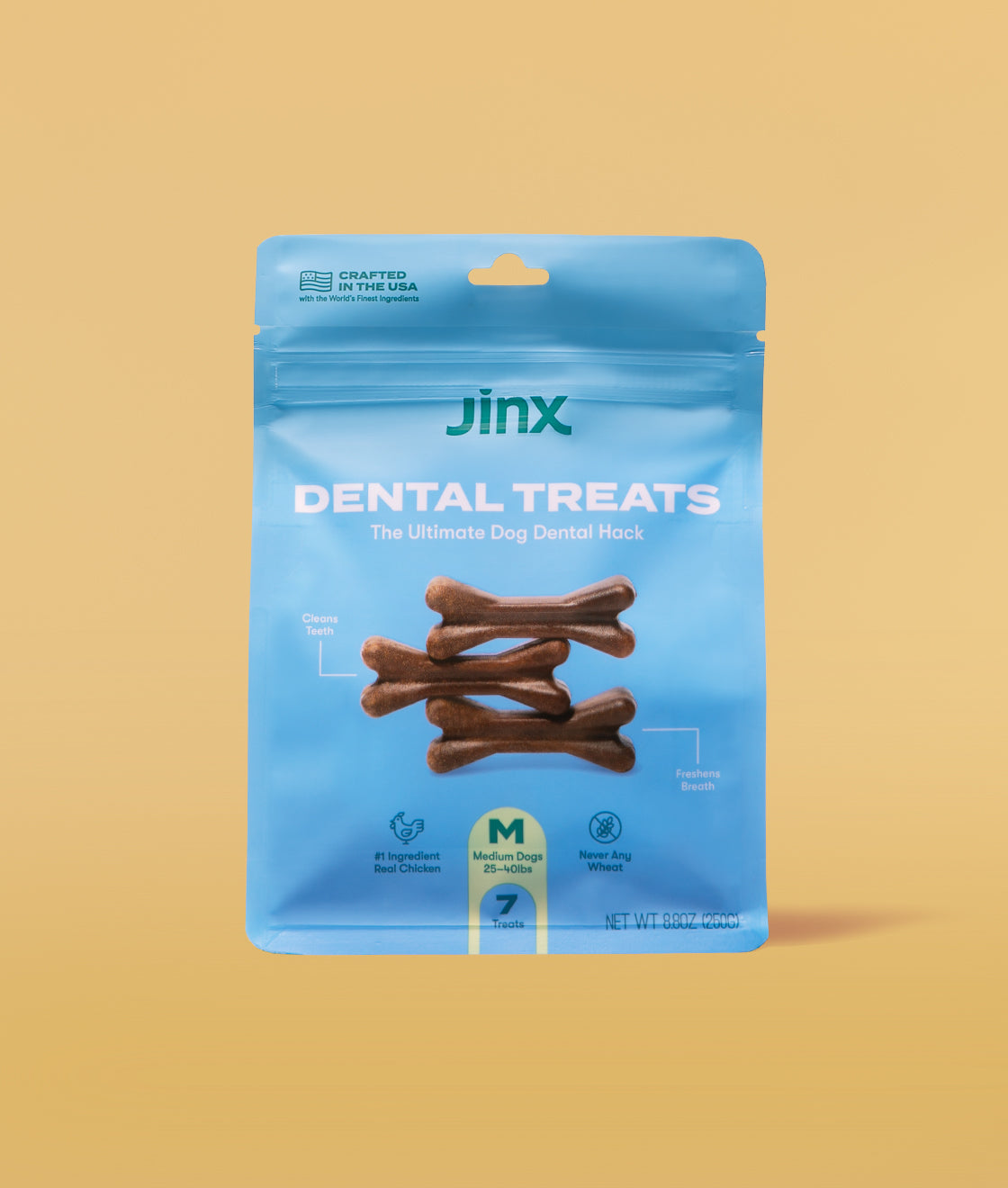Dental treats Jinx product packaging on a yellow background. 