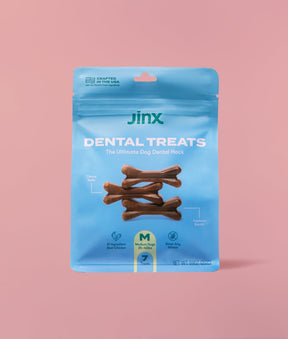 Dental dog treats Jinx product packaging on a pink background